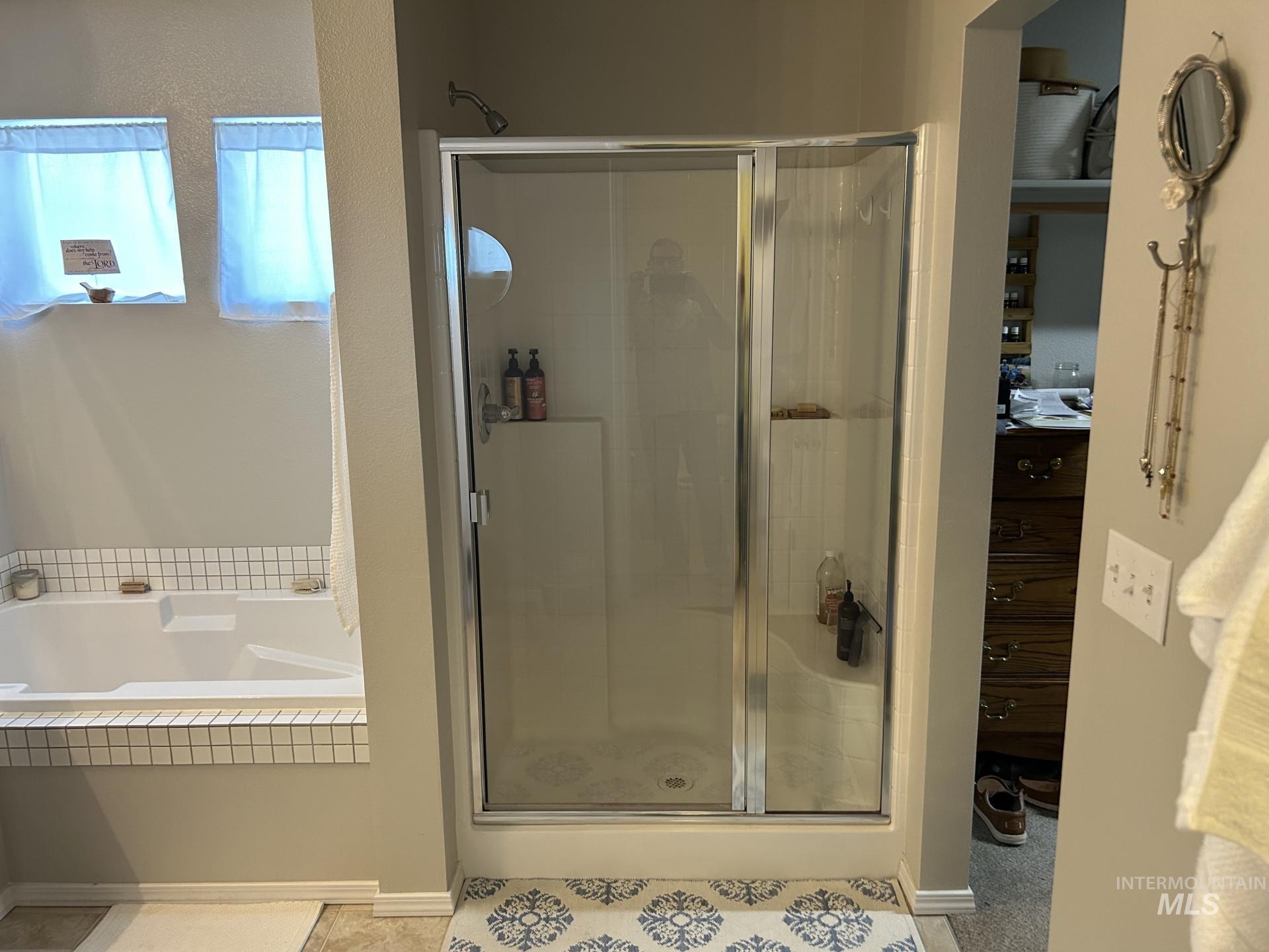 5614 Barkley Way Caldwell, ID 83607 - Photo 42 of 50 Full bathroom featuring a shower stall, a bath, and light tile patterned flooring
