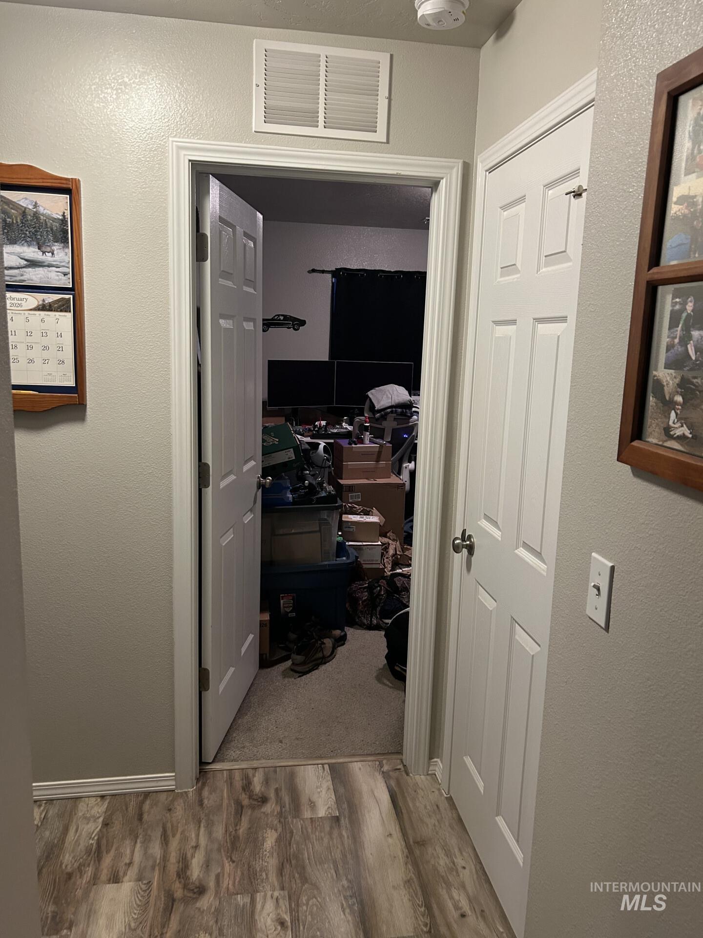5614 Barkley Way Caldwell, ID 83607 - Photo 45 of 50 Hallway featuring a textured wall and light wood finished floors