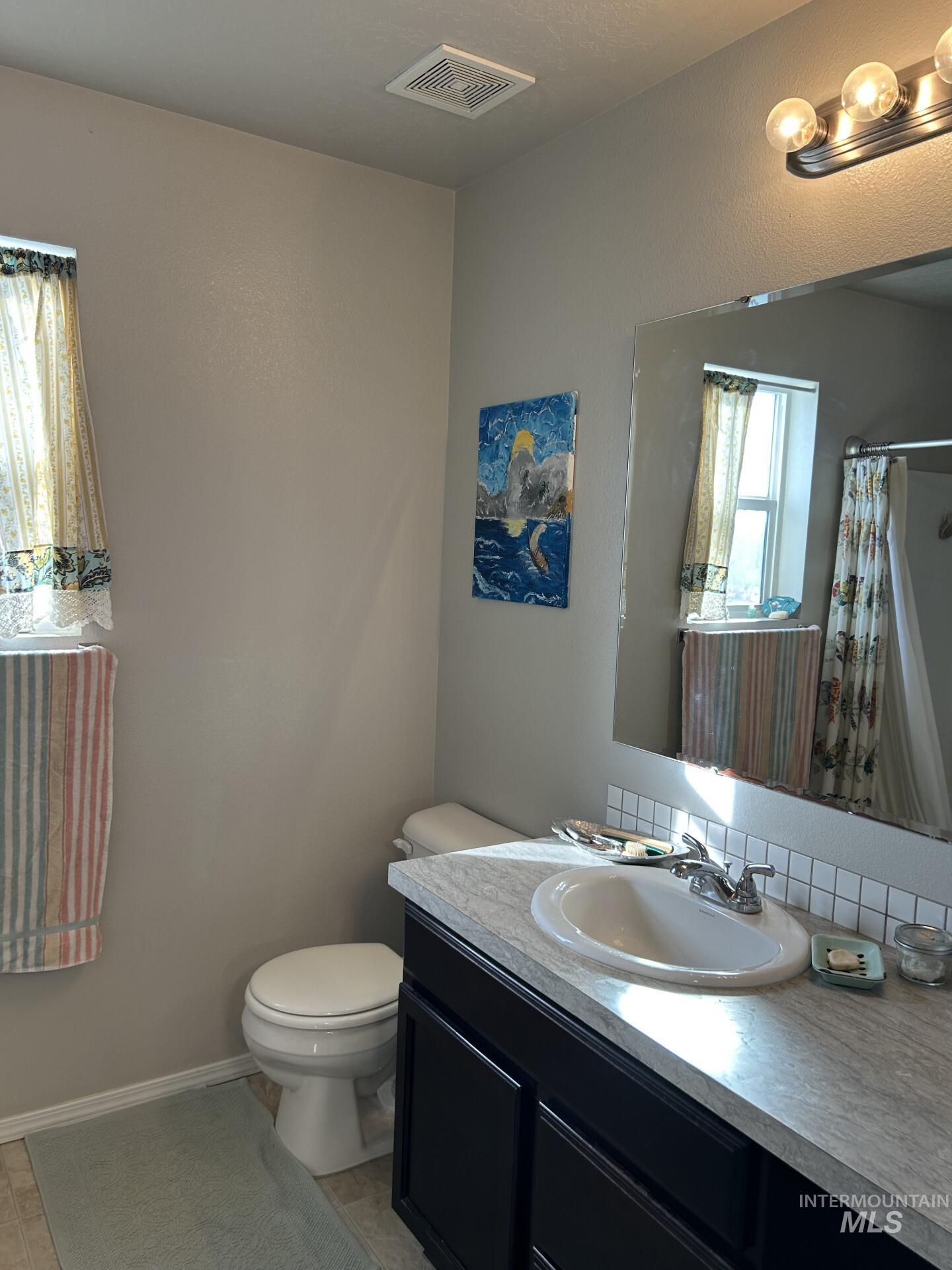 5614 Barkley Way Caldwell, ID 83607 - Photo 46 of 50 Full bathroom featuring vanity and a shower with shower curtain