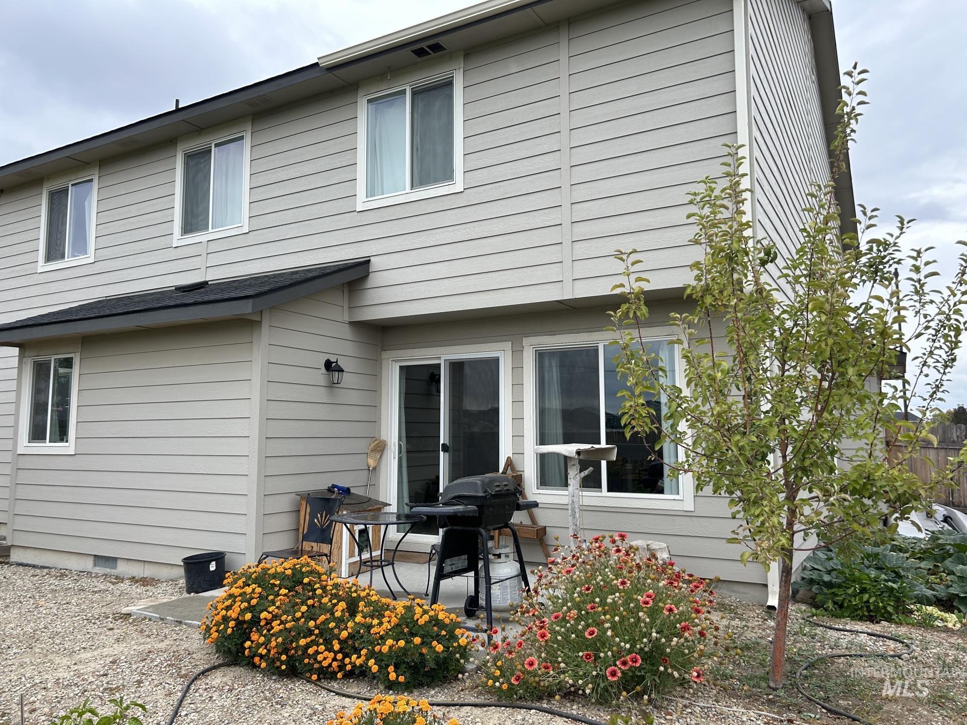 5614 Barkley Way Caldwell, ID 83607 - Photo 6 of 50 Rear view of house with a patio and crawl space