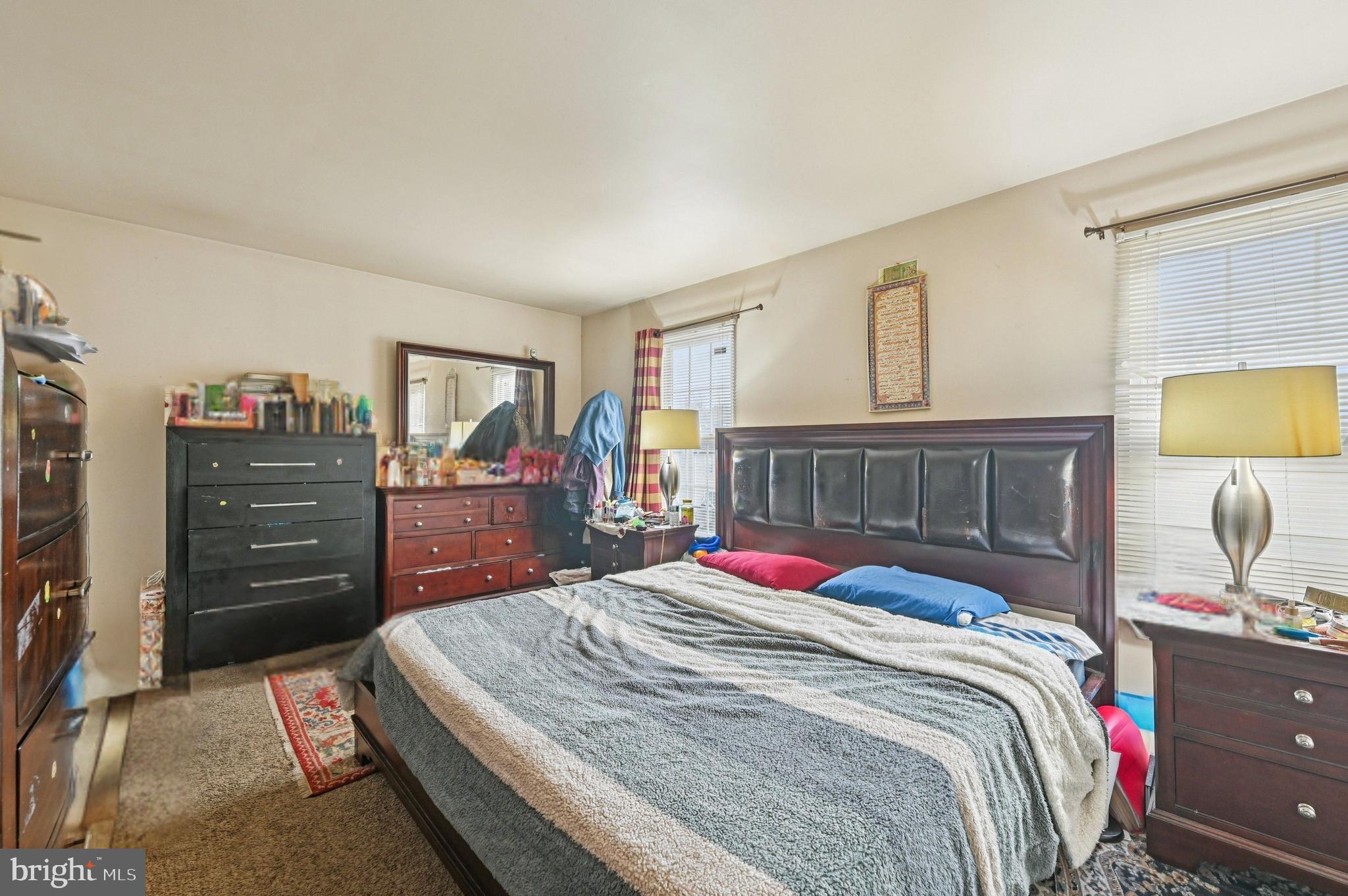 6919 Myersview Drive Baltimore, MD 21220 - Photo 6 of 19 a bed room with a bed and a lamp