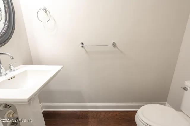 a bathroom with a toilet and a sink