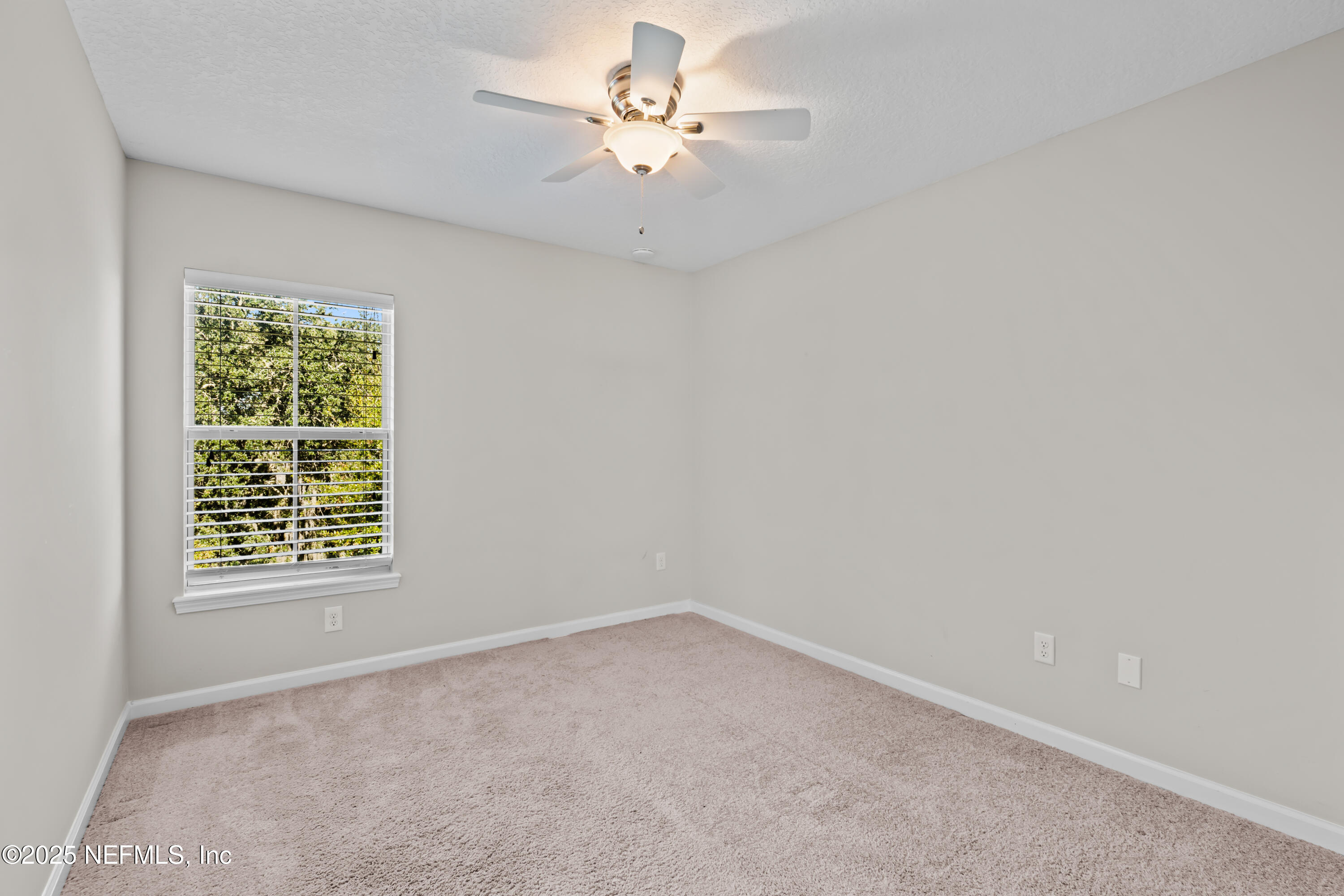 4187 Quail Drive St. Augustine, FL 32084 - Photo 17 of 38 wooden floor in an empty room with a window
