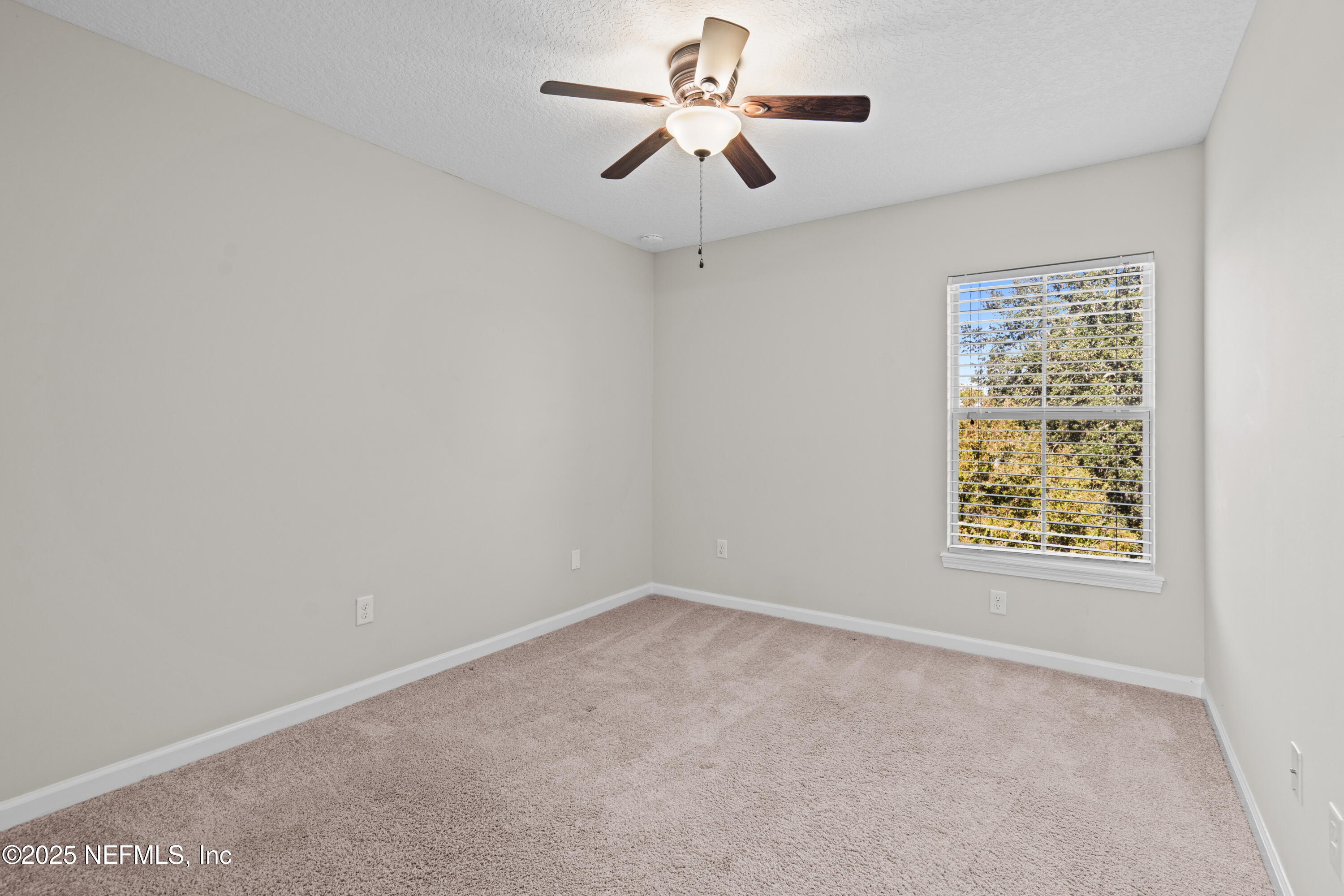4187 Quail Drive St. Augustine, FL 32084 - Photo 20 of 38 a view of an empty room with a window