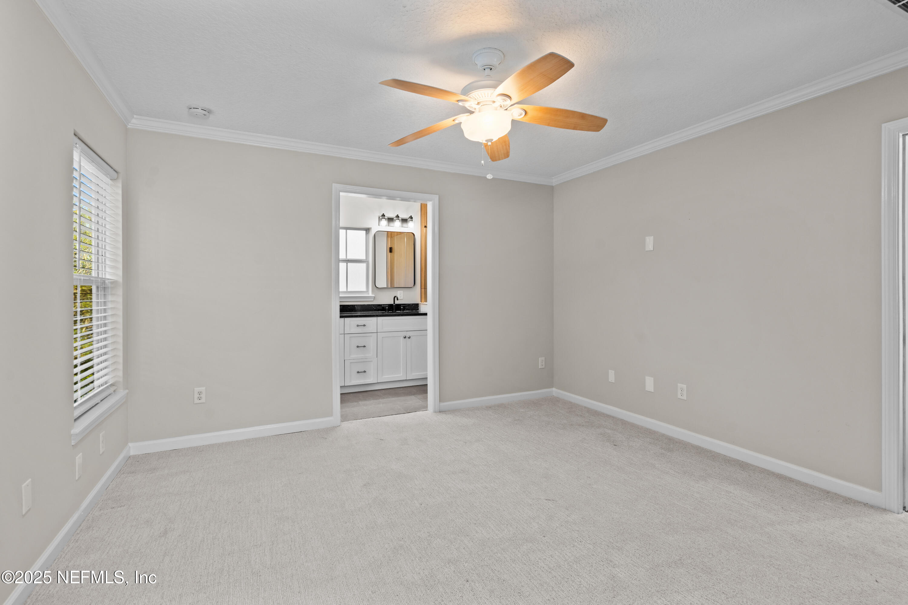 4187 Quail Drive St. Augustine, FL 32084 - Photo 24 of 38 an empty room with closet and windows