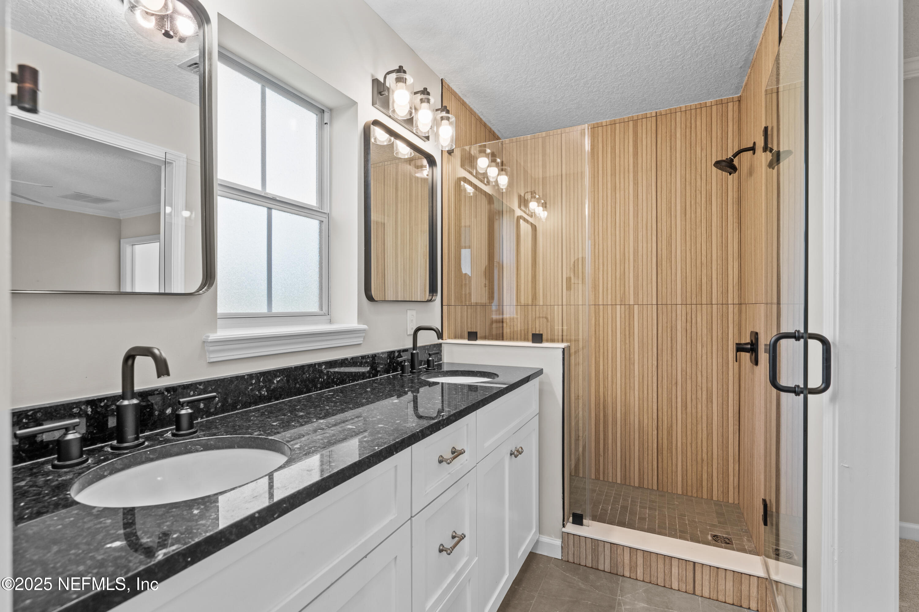 4187 Quail Drive St. Augustine, FL 32084 - Photo 25 of 38 a bathroom with a granite countertop sink mirror and double