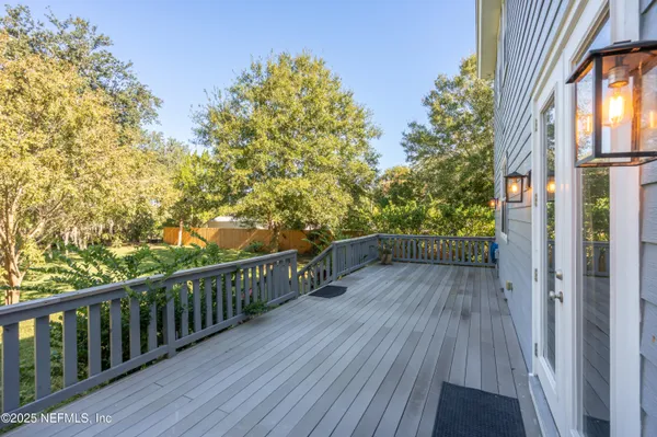 a view of balcony with wooden floor