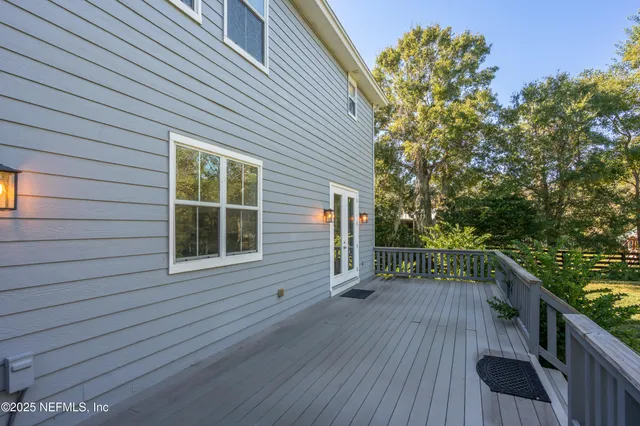 a view of a balcony with wooden floor