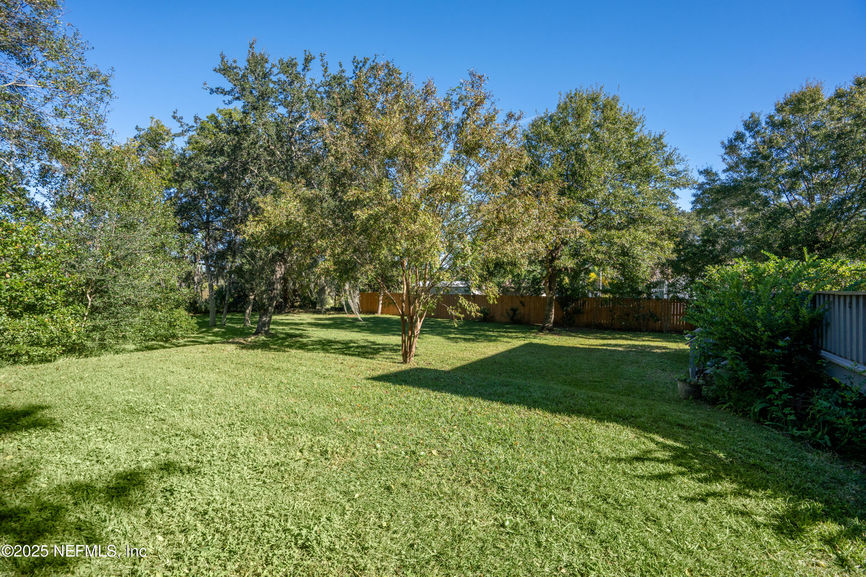 4187 Quail Drive St. Augustine, FL 32084 - Photo 34 of 38 a view of a field with trees in the background