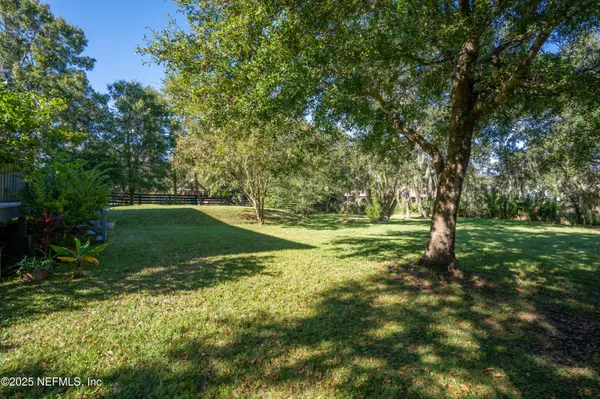 a view of outdoor space with trees all around
