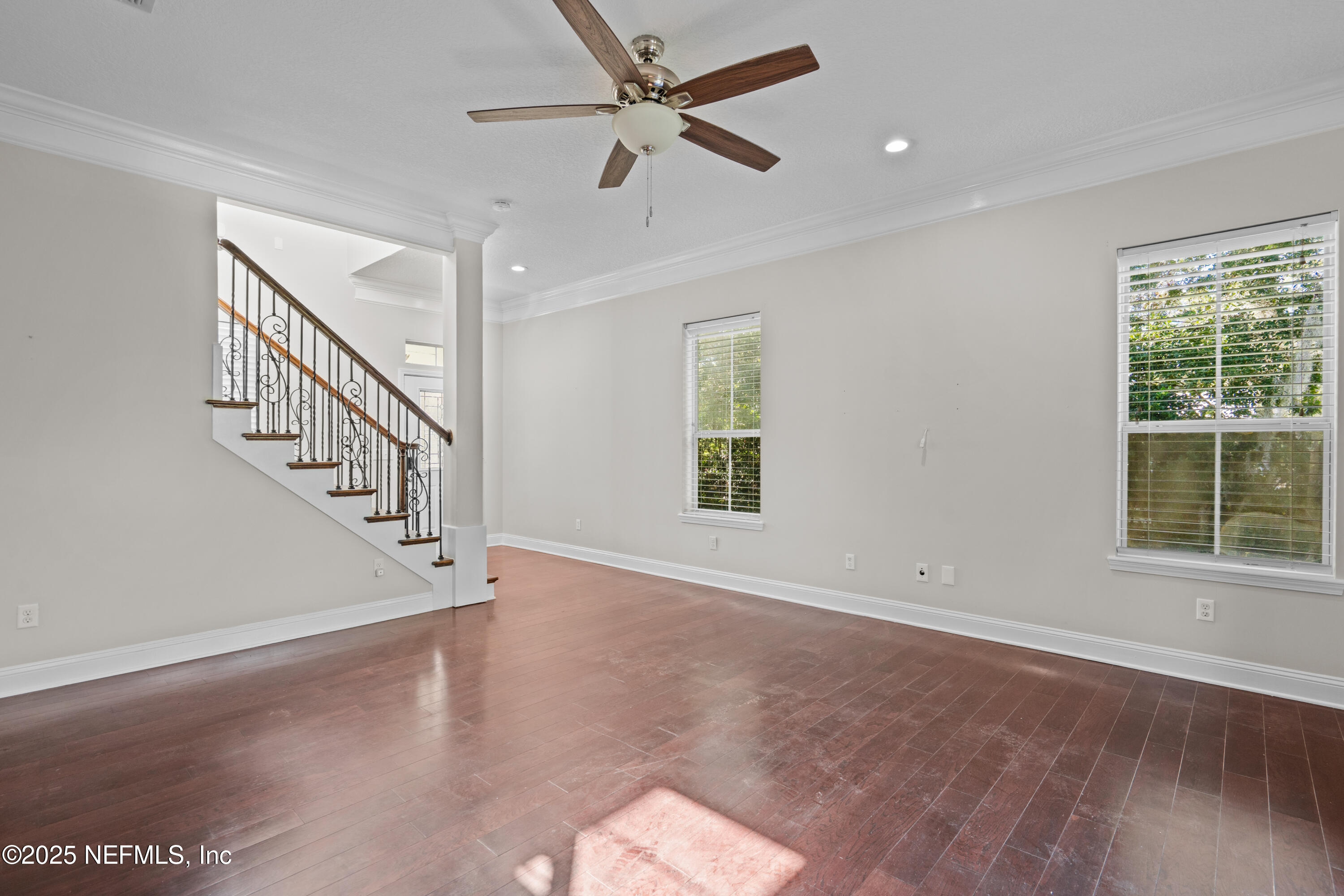 4187 Quail Drive St. Augustine, FL 32084 - Photo 5 of 38 a view of an empty room with wooden floor and a window