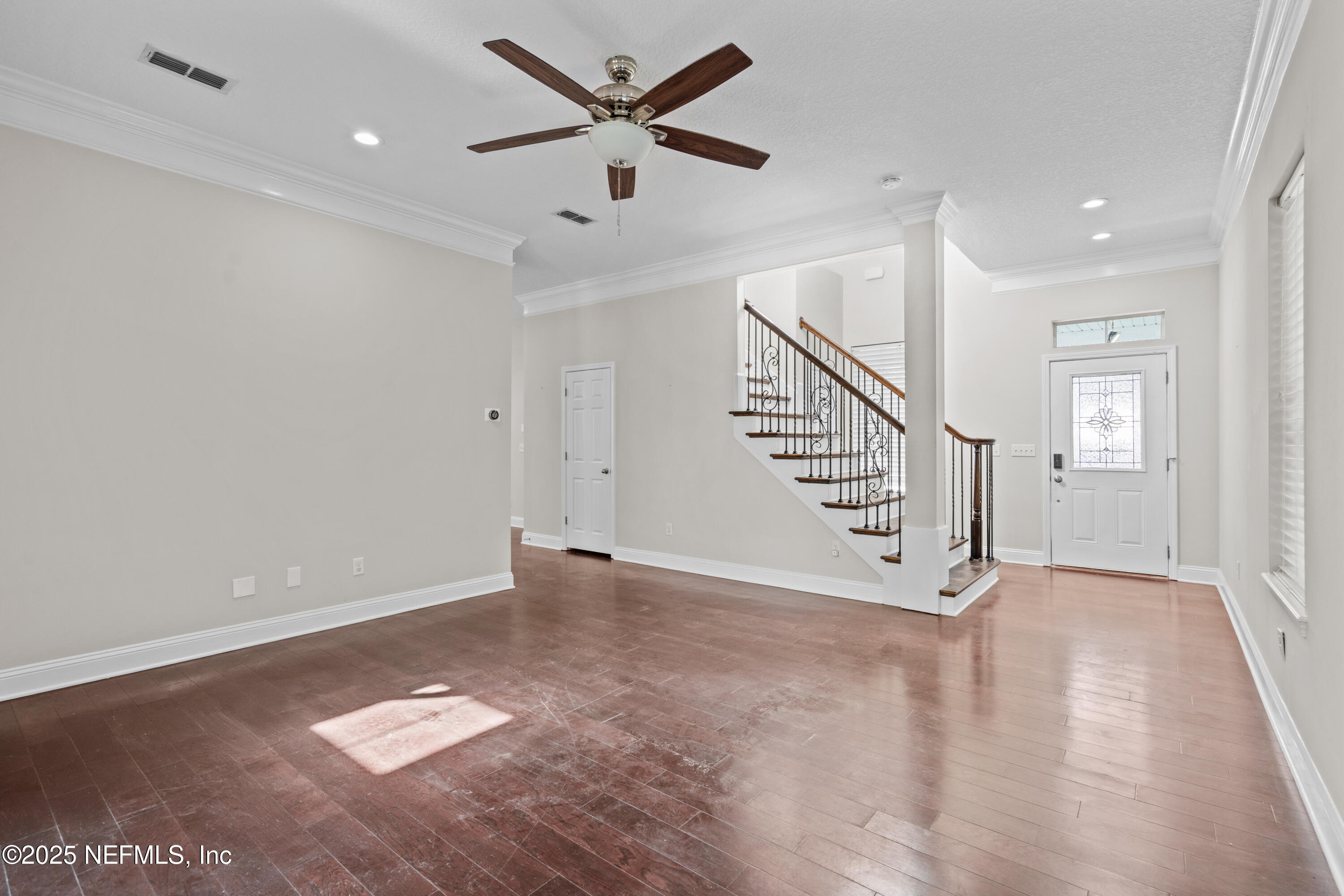 4187 Quail Drive St. Augustine, FL 32084 - Photo 7 of 38 wooden floor in an empty room with a window