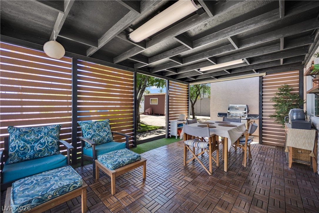 530 Grape Drive Henderson, NV 89015 - Photo 14 of 39 An inviting covered patio features a grill, providing a superb setting for outdoor gatherings and relaxation.