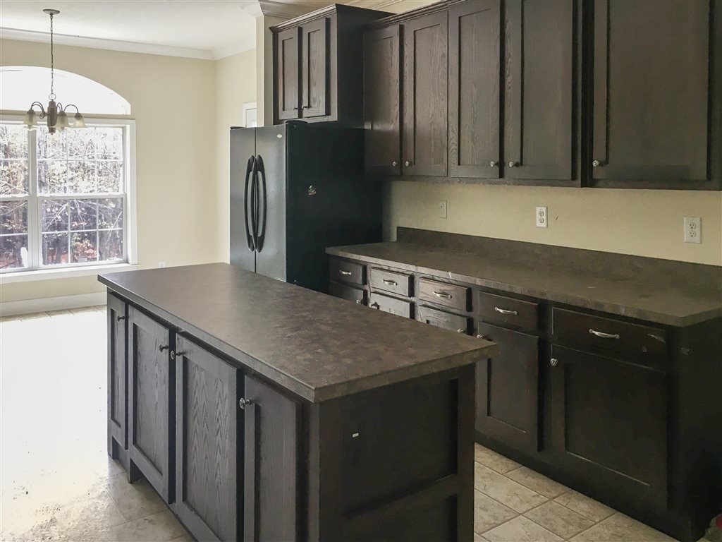 1316 Miles Jackson Road Palmyra, VA 22963 - Photo 11 of 22 a kitchen with stainless steel appliances granite countertop a sink dishwasher a refrigerator and cabinets with wooden floor