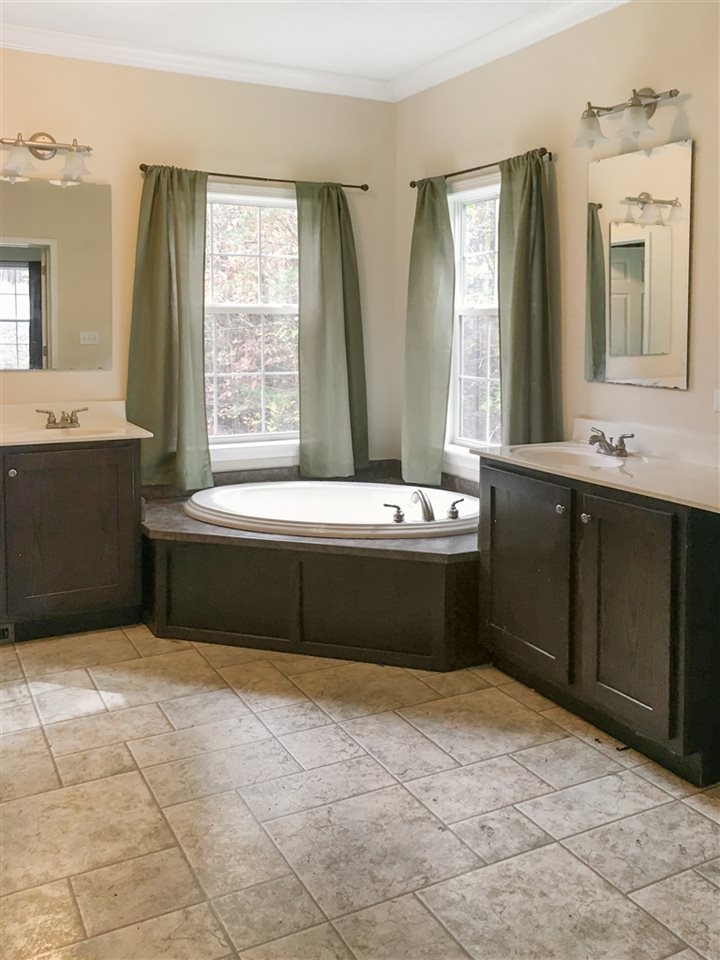 1316 Miles Jackson Road Palmyra, VA 22963 - Photo 18 of 22 a bathroom with a sink a bathtub and a mirror