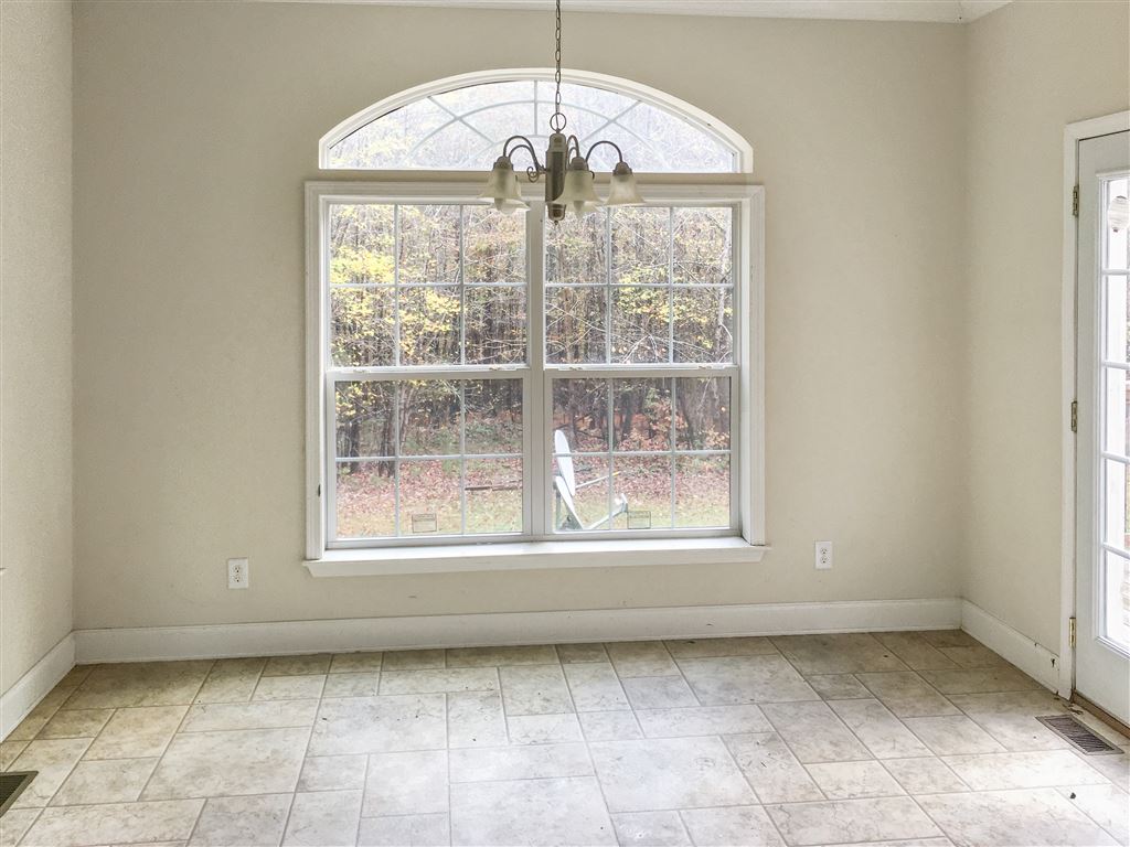 1316 Miles Jackson Road Palmyra, VA 22963 - Photo 9 of 22 a view of an empty room with a window
