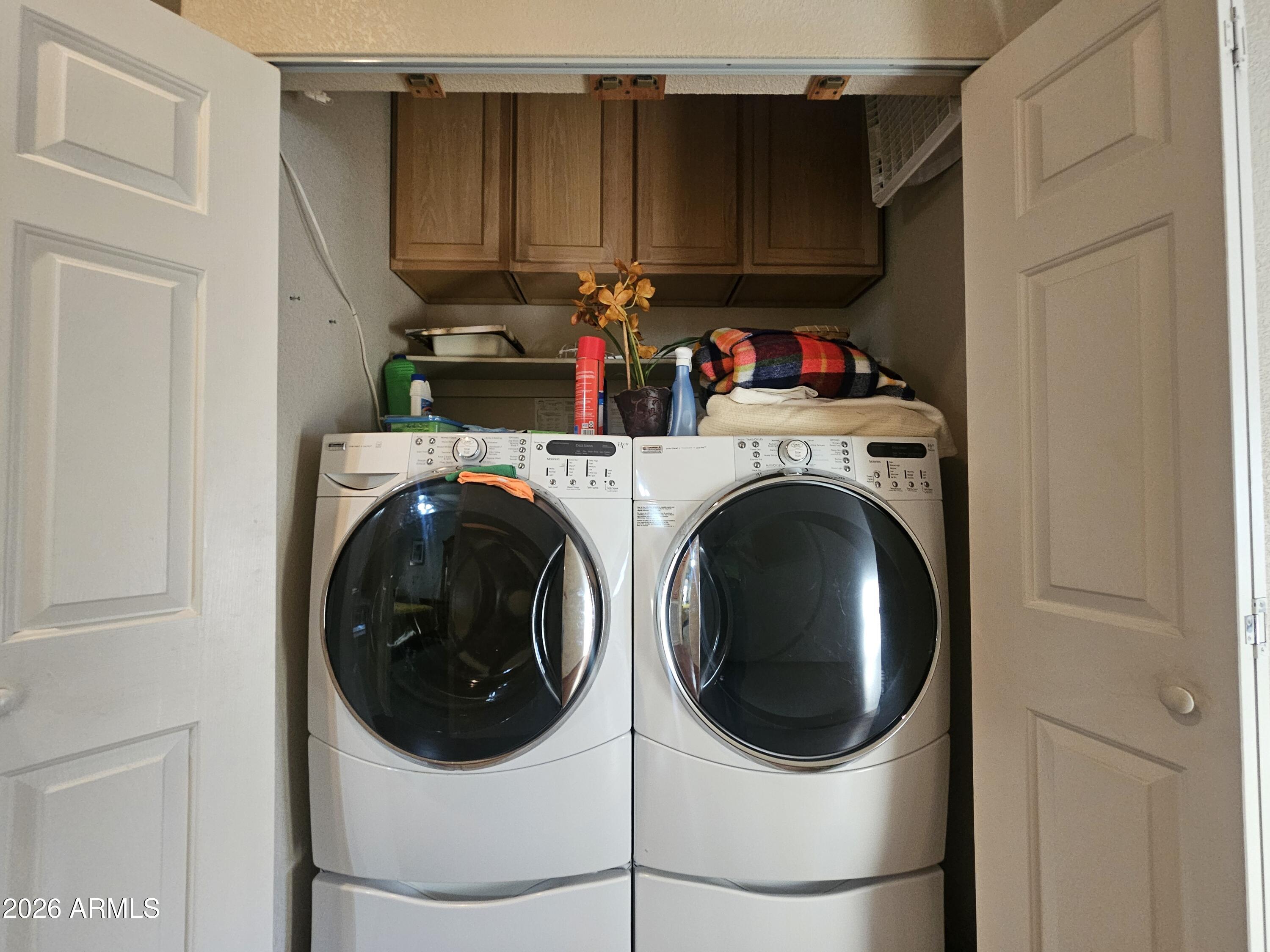 650 North Hawes Road, Unit 4410 Mesa, AZ 85207 - Photo 12 of 40 a utility room with dryer and washer