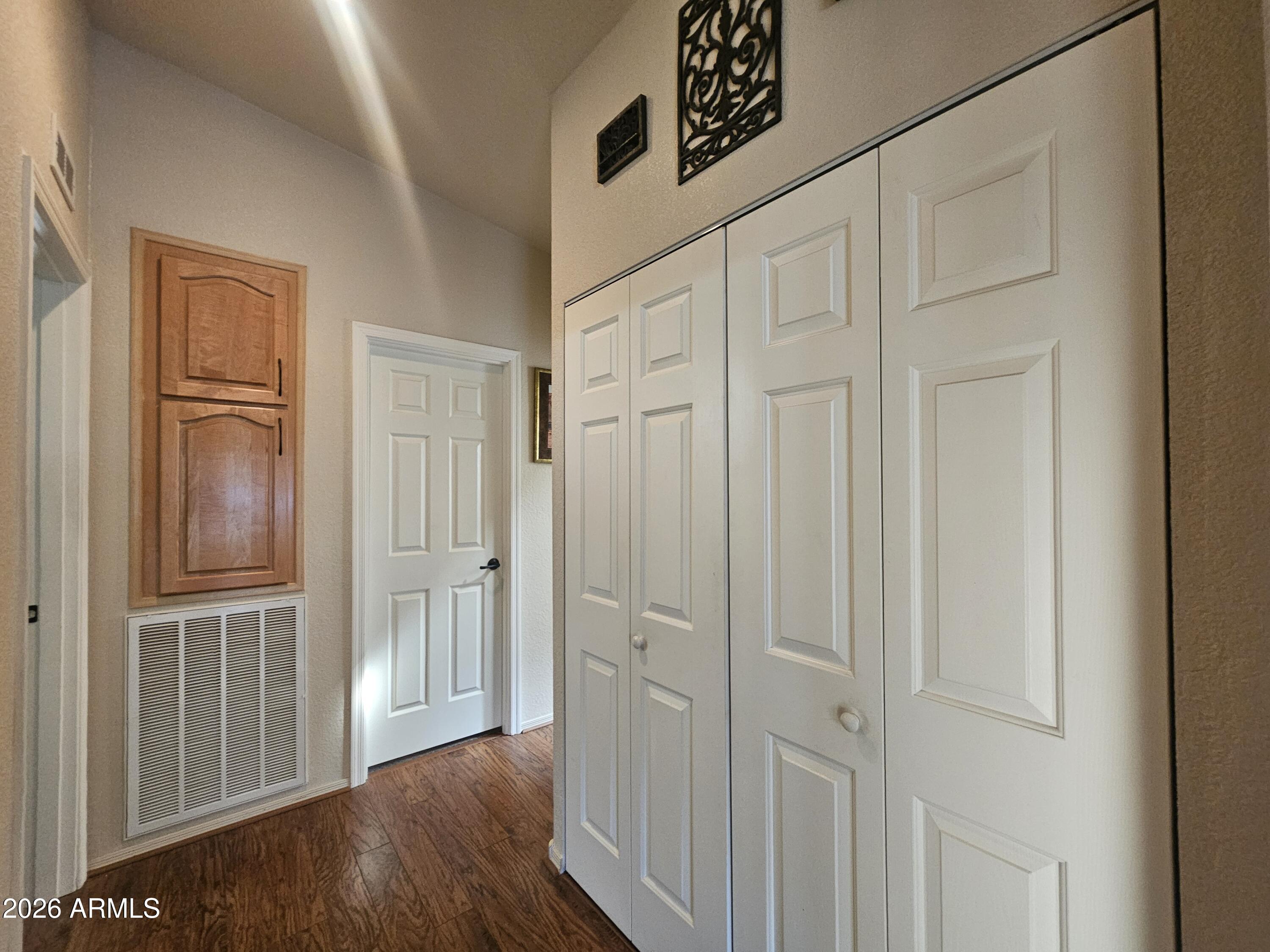650 North Hawes Road, Unit 4410 Mesa, AZ 85207 - Photo 13 of 40 a view of a hallway with wooden floor