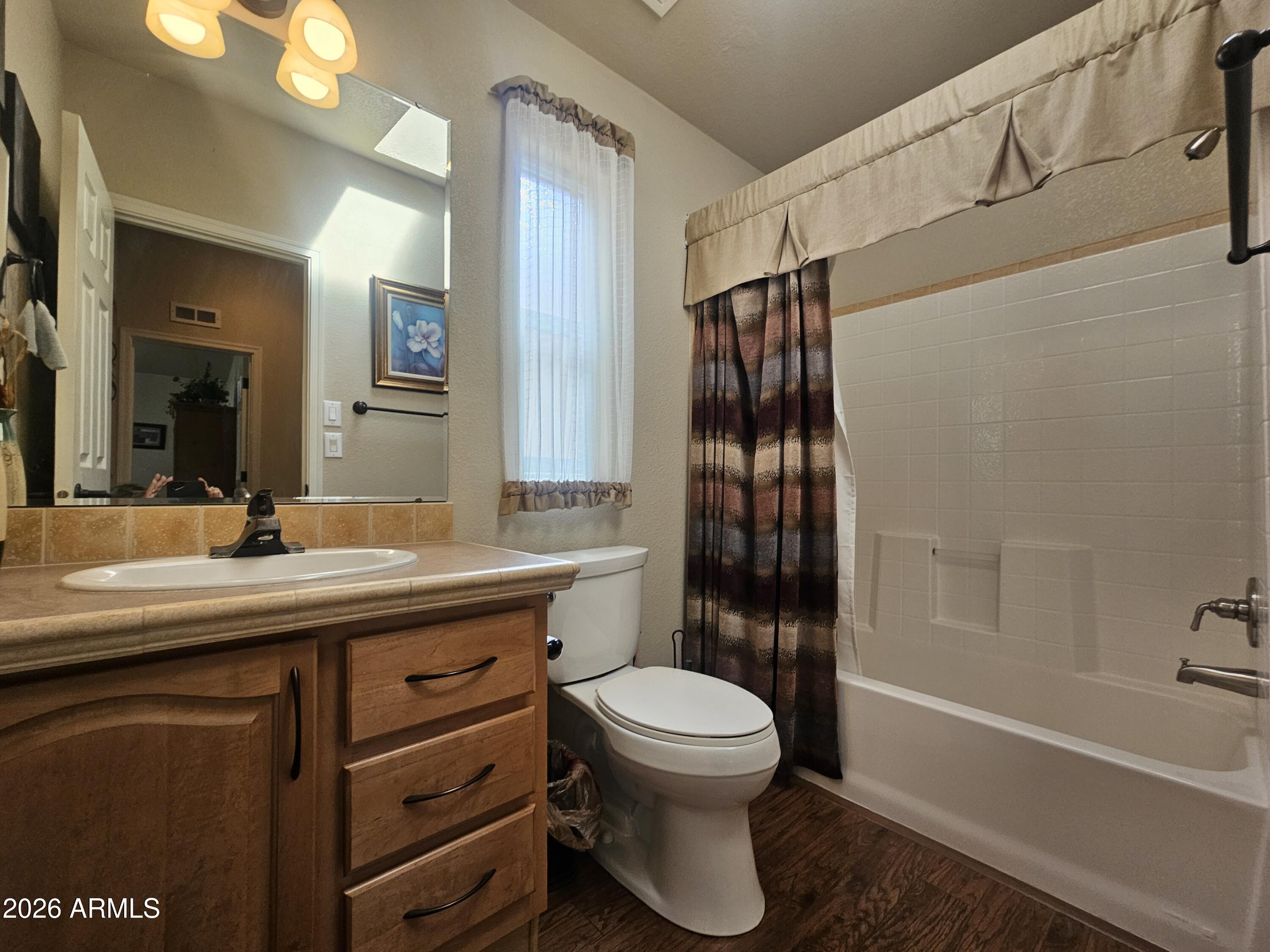 650 North Hawes Road, Unit 4410 Mesa, AZ 85207 - Photo 14 of 40 a bathroom with a sink a toilet and shower