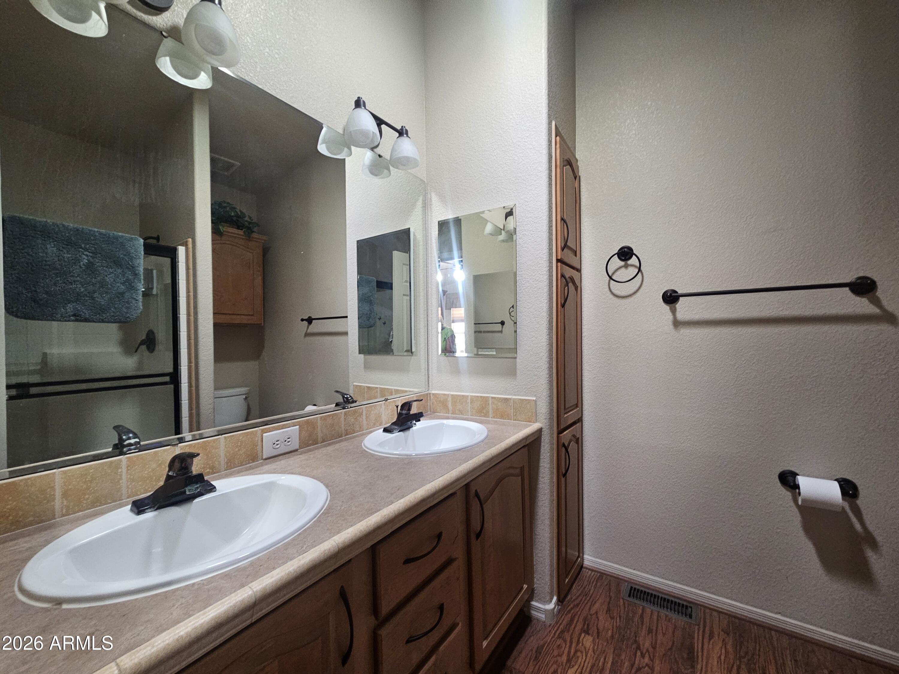 650 North Hawes Road, Unit 4410 Mesa, AZ 85207 - Photo 21 of 40 a bathroom with a sink and a mirror