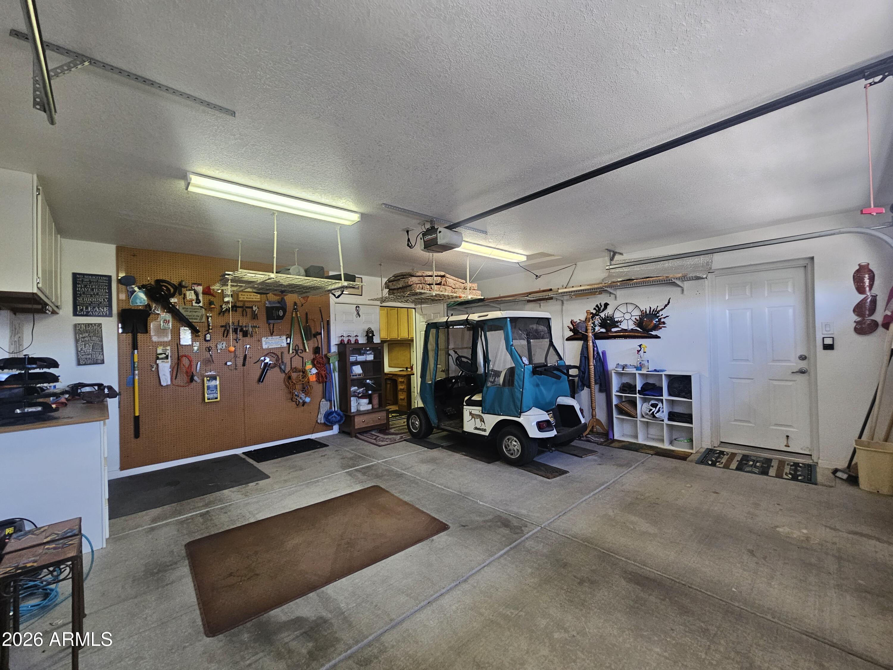 650 North Hawes Road, Unit 4410 Mesa, AZ 85207 - Photo 25 of 40 a view of a garage with storage