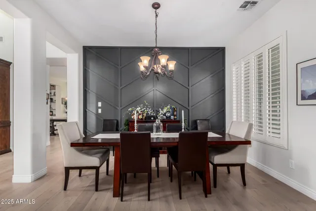 a view of living room with furniture and ceiling fan