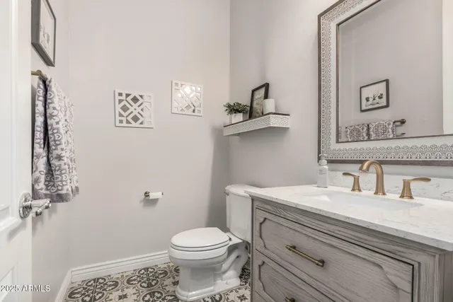 a kitchen with a sink and a stove top oven