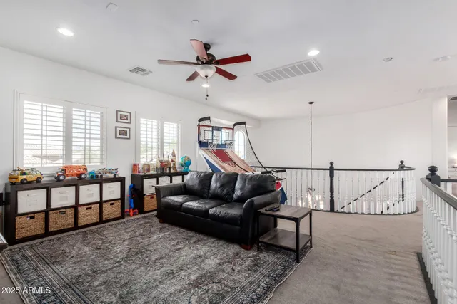 a bedroom with a bed and a dresser in it