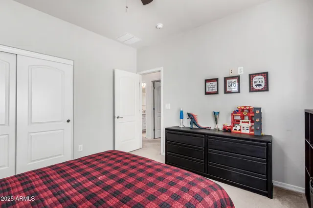 a view of a patio with a table and chairs
