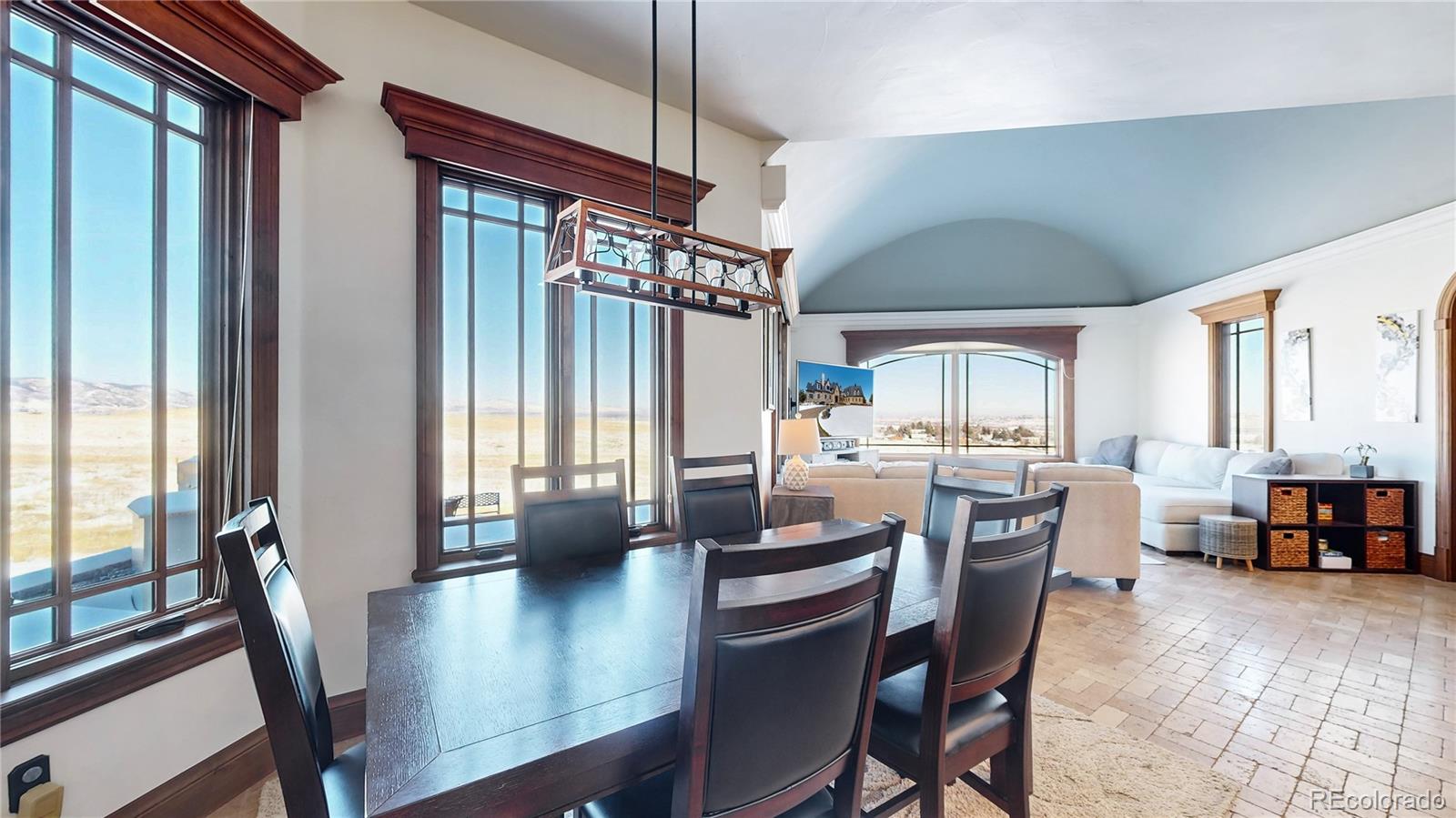 7755 North Moore Road Littleton, CO 80125 - Photo 13 of 46 a view of a dining room with furniture window and outside view