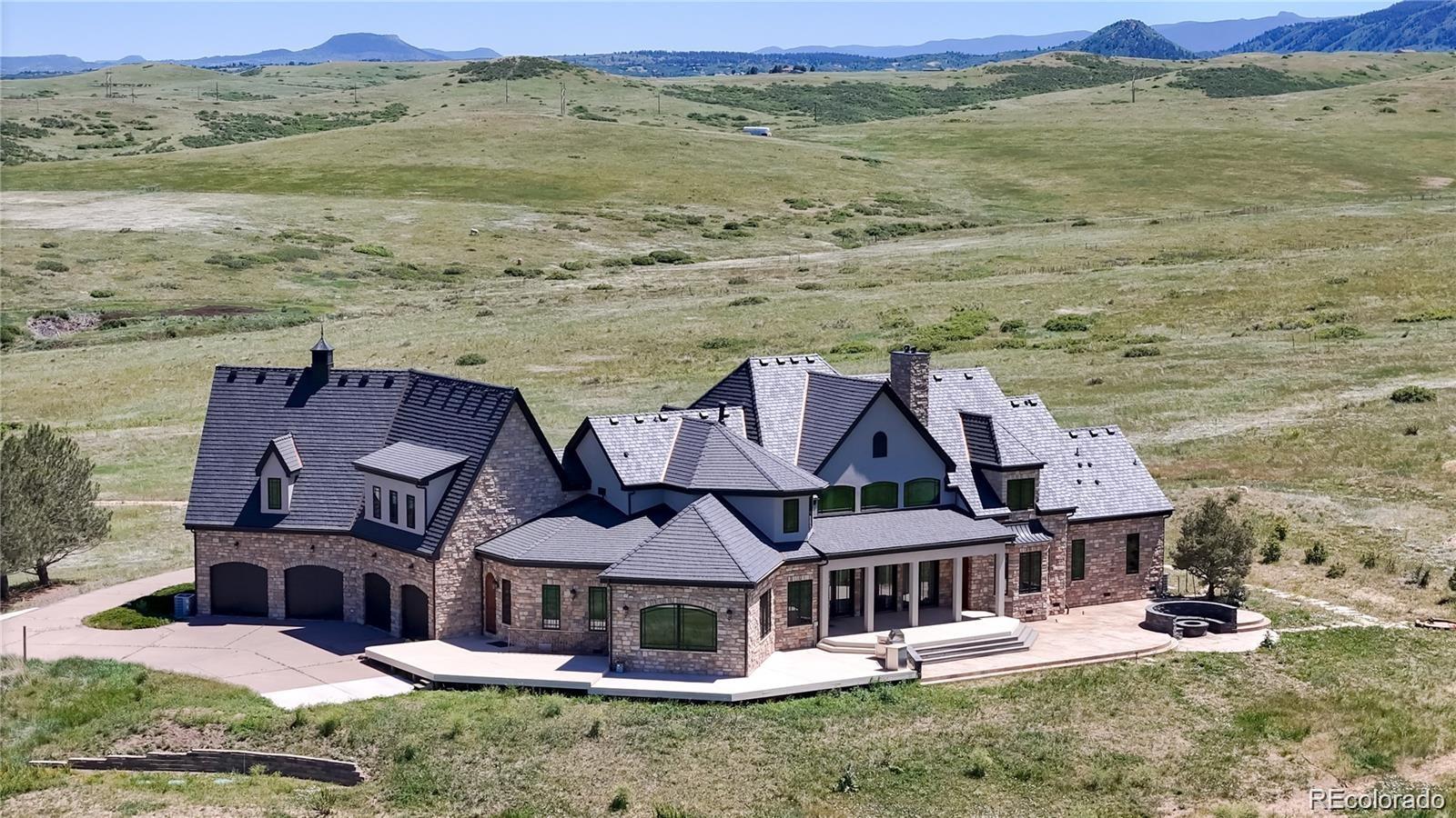 7755 North Moore Road Littleton, CO 80125 - Photo 2 of 46 an aerial view of residential houses with outdoor space and ocean view
