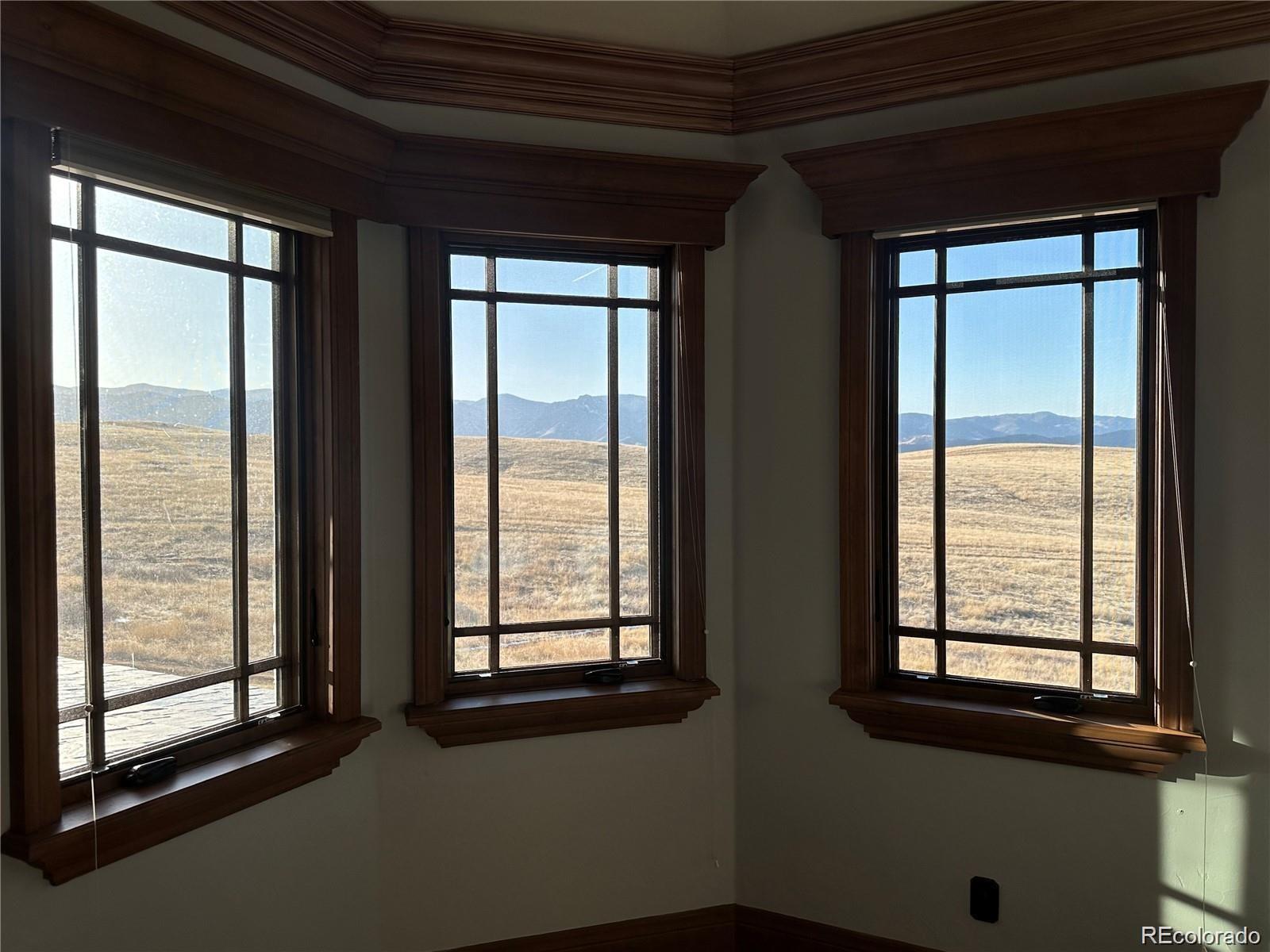 7755 North Moore Road Littleton, CO 80125 - Photo 21 of 46 a view of an empty room with a window