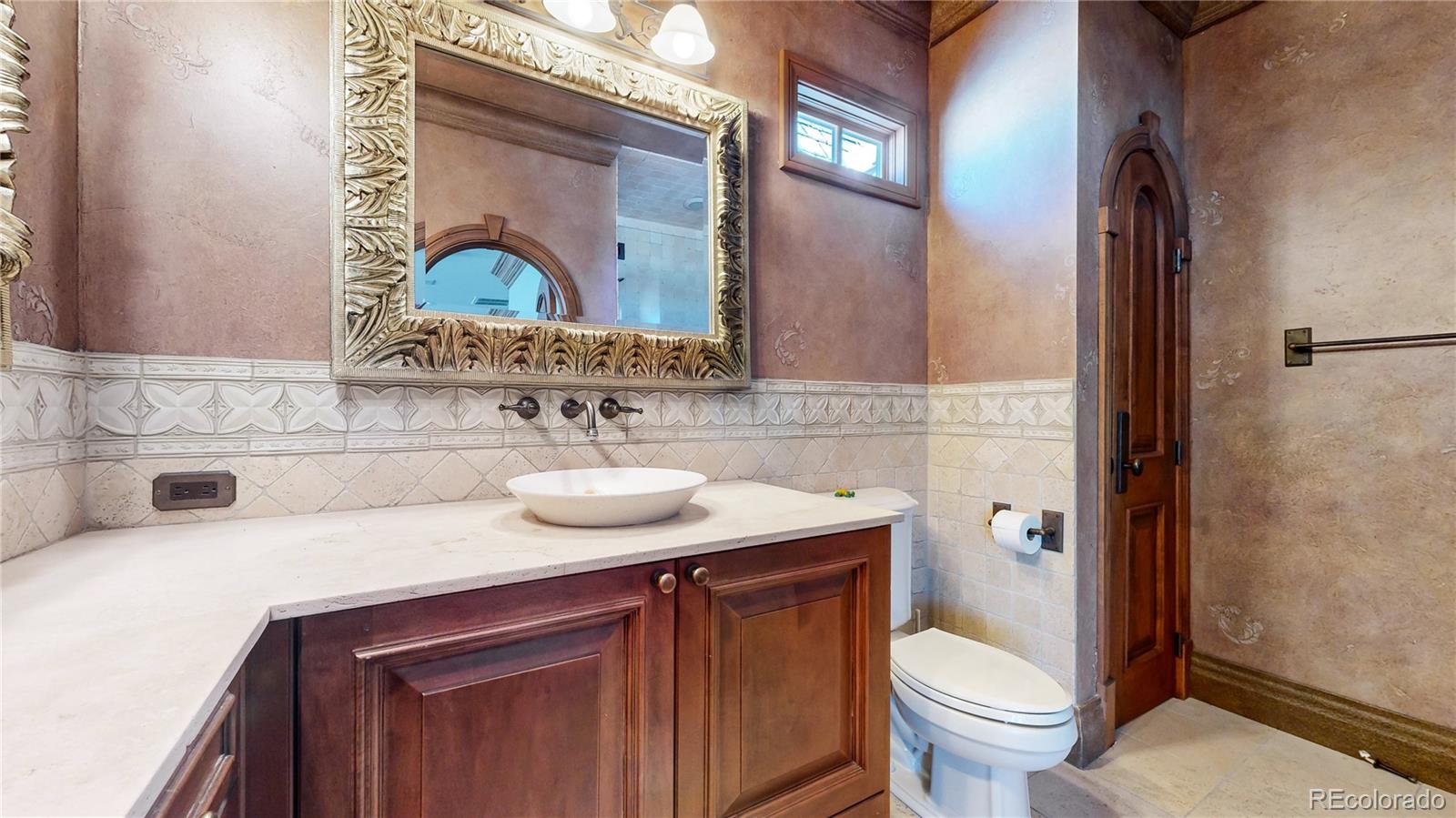 7755 North Moore Road Littleton, CO 80125 - Photo 23 of 46 a bathroom with a sink toilet and shower