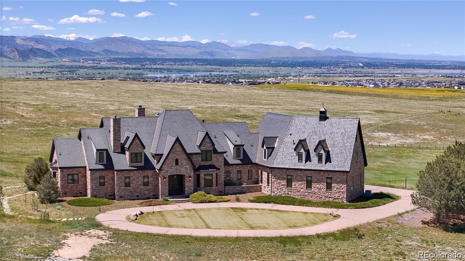 7755 North Moore Road Littleton, CO 80125 - Photo 34 of 46 a view of a house with outdoor space and ocean view