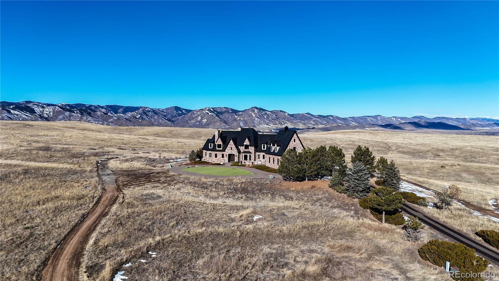 7755 North Moore Road Littleton, CO 80125 - Photo 42 of 46 a view of an ocean with a mountain in the back
