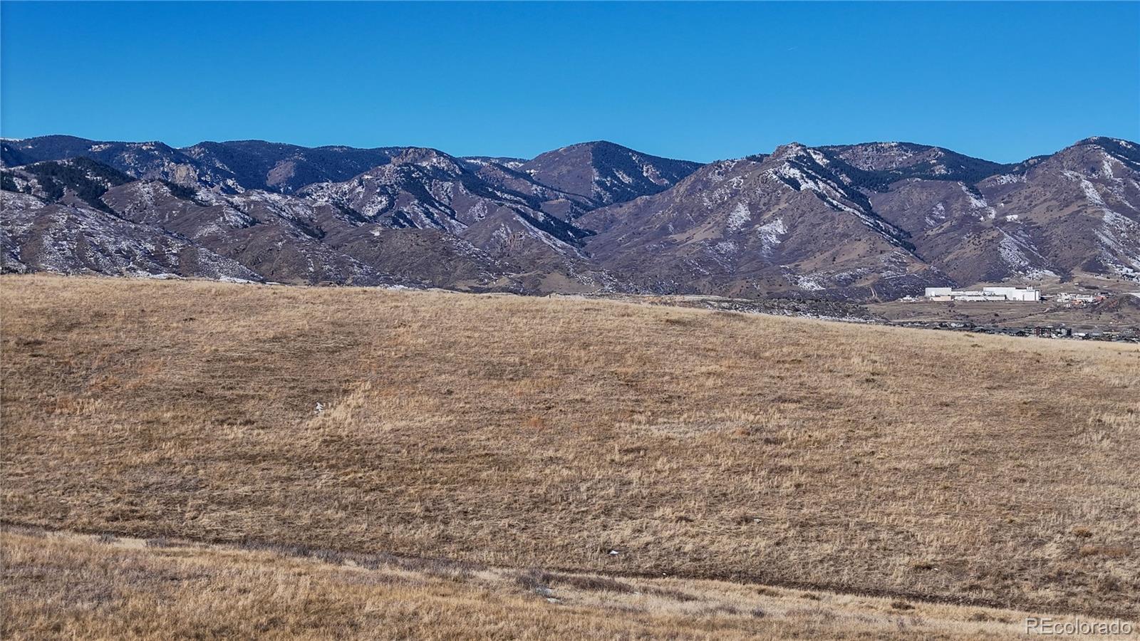 7755 North Moore Road Littleton, CO 80125 - Photo 43 of 46 a view of a large mountains with a mountain in the background