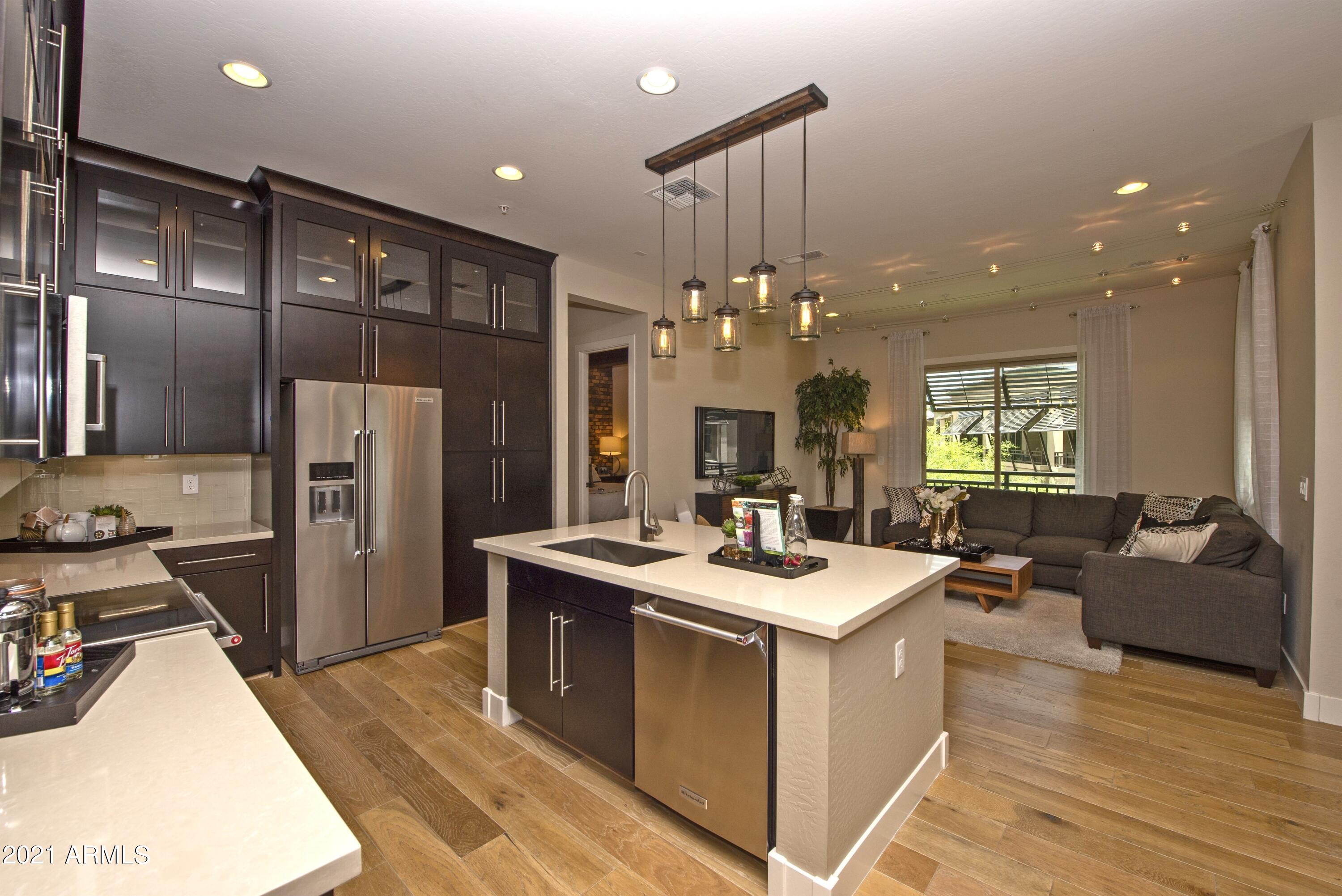 6565 East Thomas Road, Unit 1042 Scottsdale, AZ 85251 - Photo 4 of 22 a kitchen with a sink appliances and cabinets