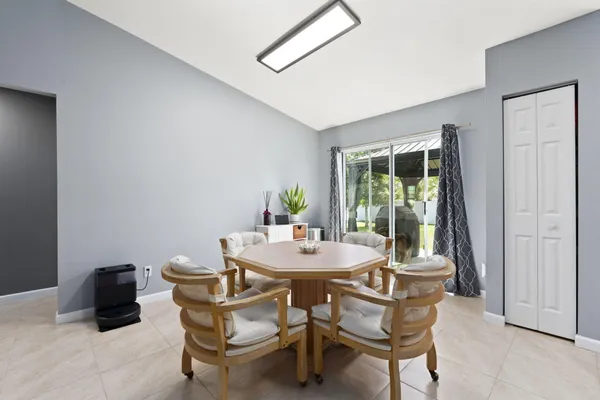 a dining room with furniture and window