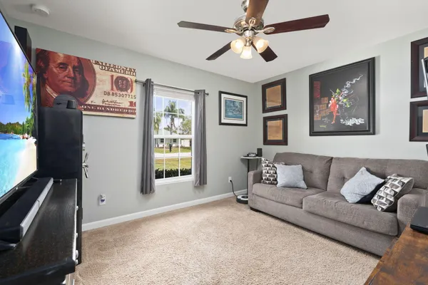a living room with furniture and a window
