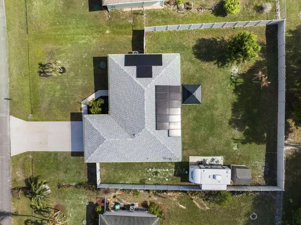 an aerial view of a house with a lake view