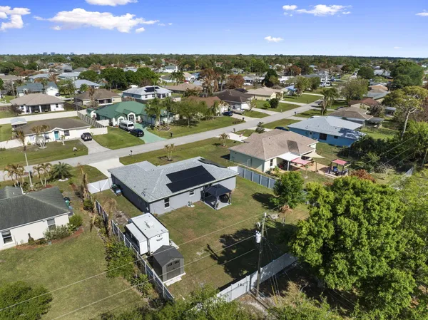 an aerial view of residential houses with outdoor space