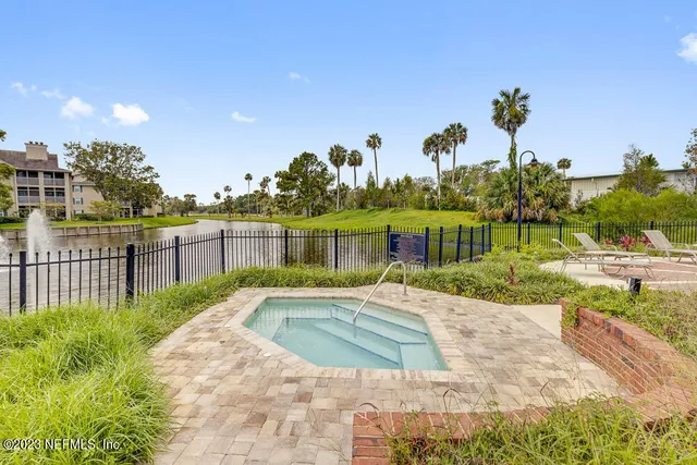 a view of a swimming pool with a patio