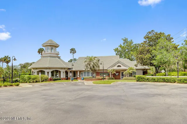 a view of swimming pool with a house in the background