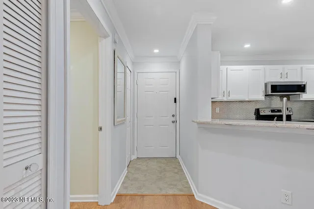 a view of a kitchen cabinets and a counter place