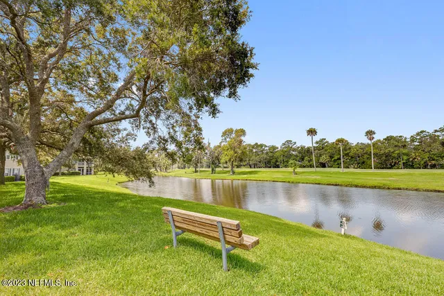 a view of a lake with houses with outdoor space