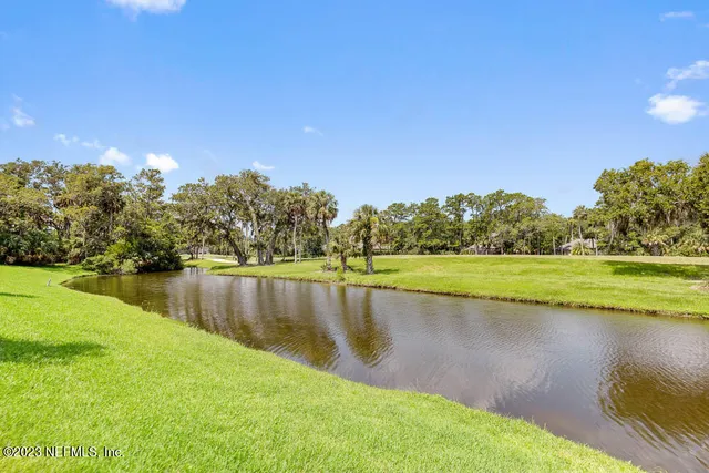 a view of a lake with a yard