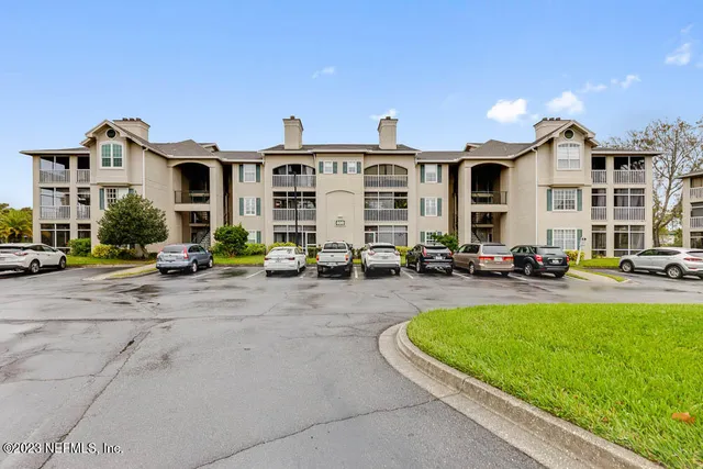 a view of a house with swimming pool and sitting area