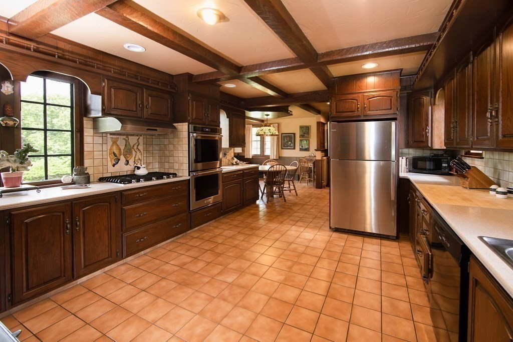 17 Longview Road Reading, MA 01867 - Photo 13 of 42 a kitchen with stainless steel appliances a refrigerator and a sink