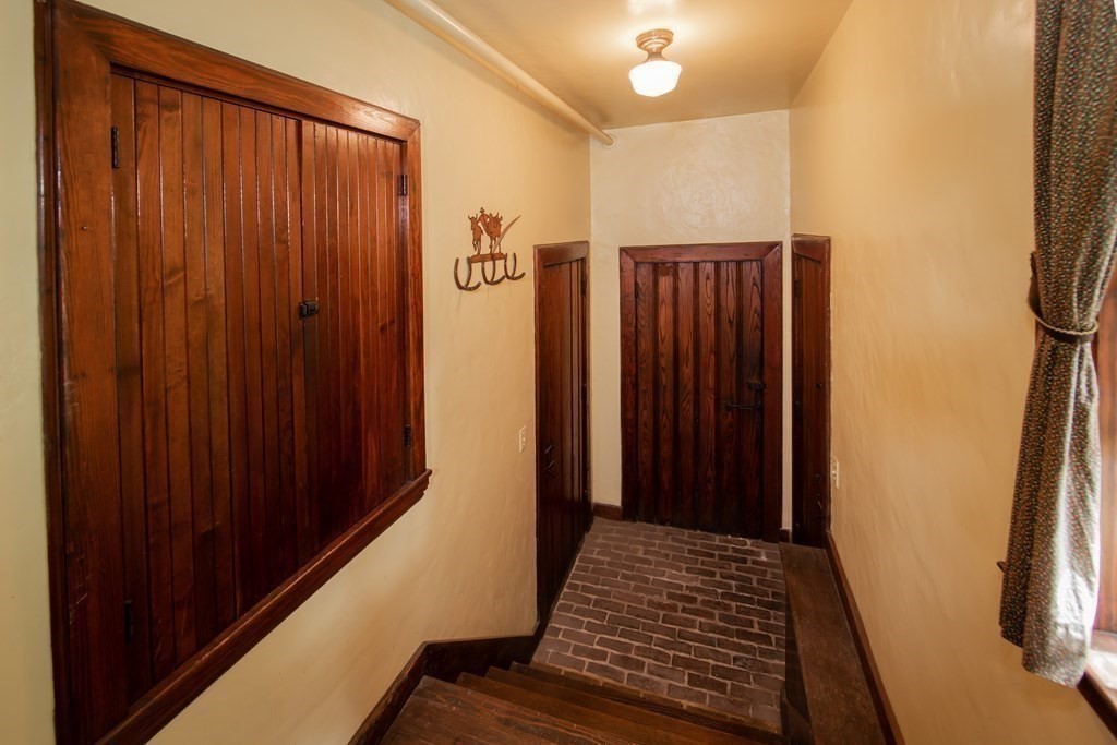 17 Longview Road Reading, MA 01867 - Photo 16 of 42 a view of a hallway with wooden floor and staircase