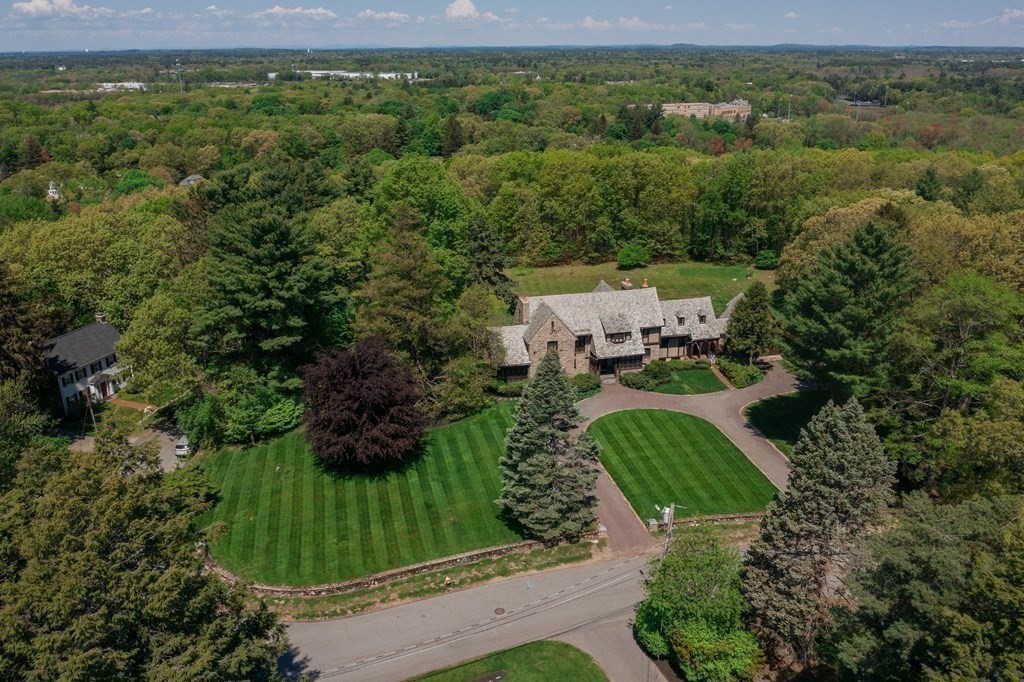 17 Longview Road Reading, MA 01867 - Photo 2 of 42 a view of a green yard with large trees